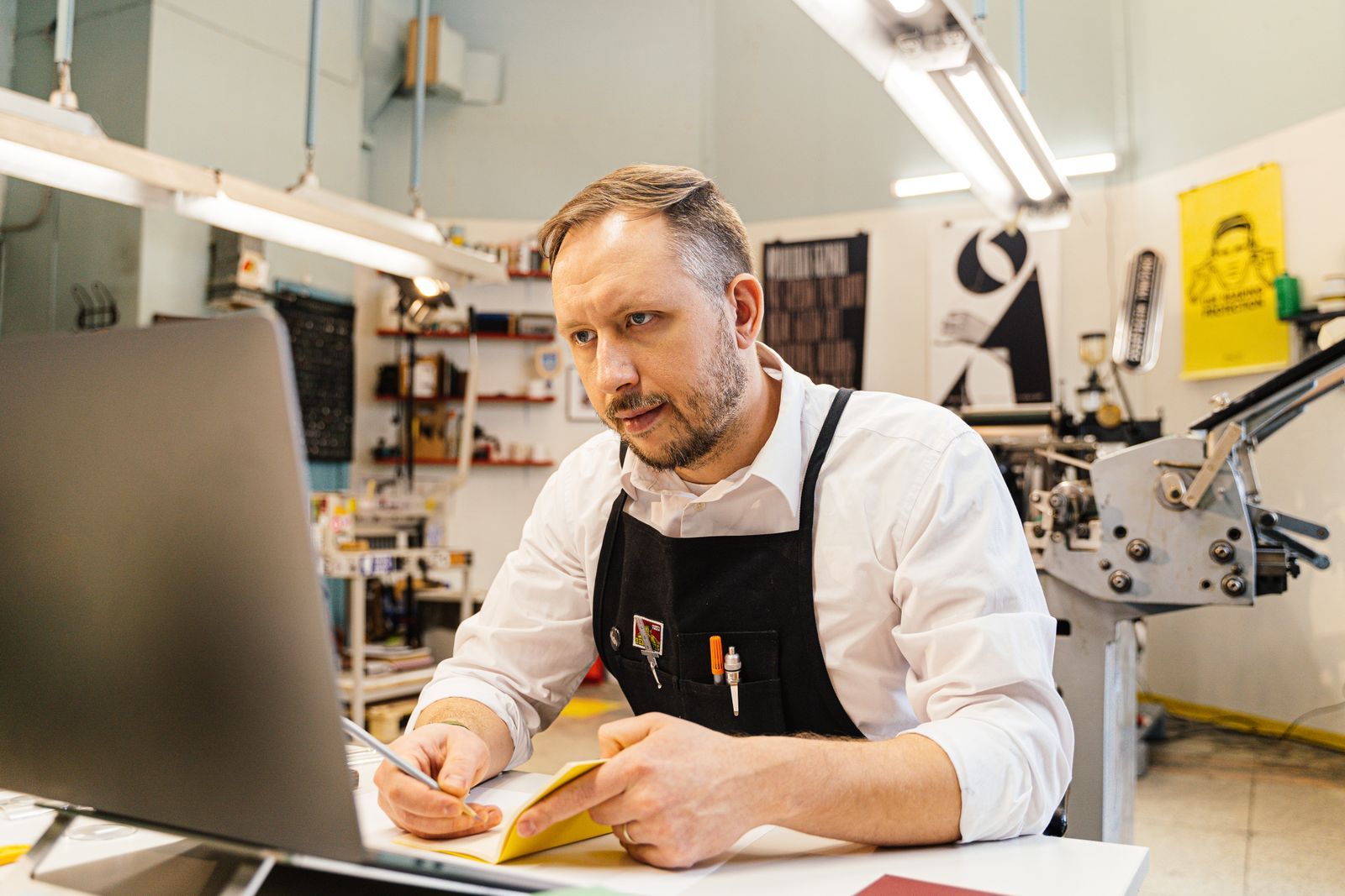 A business owner at work in their own shop.
